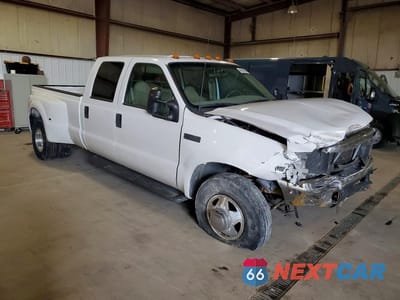 Czwarte zdjęcie samochodu z boku: 1999 FORD F350 SUPER DUTY VIN:1FTWW32S9XEF00535 - miniatura