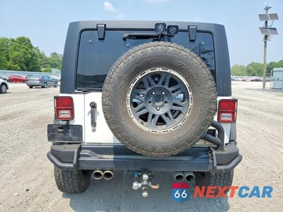 Zdjęcie 6 z 13 samochodu: 2013 JEEP WRANGLER UNLIMITED SAHARA VIN:1C4HJWEG2DL601987 - miniatura
