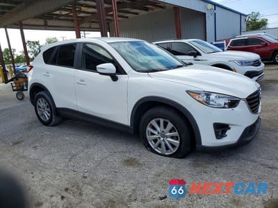 Czwarte zdjęcie samochodu z boku: 2016 MAZDA CX-5 TOURING VIN:JM3KE2CY4G0635635 - miniatura