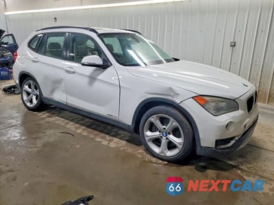 Czwarte zdjęcie samochodu z boku: 2013 BMW X1 XDRIVE35I VIN:WBAVM5C50DVV90477 - miniatura