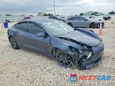Czwarte zdjęcie samochodu z boku: 2023 TESLA MODEL 3 VIN:5YJ3E1EA4PF695178 - miniatura