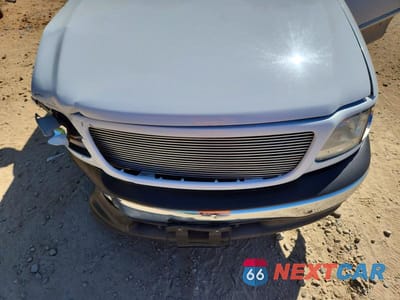 Zdjęcie 11 z 12 samochodu: 2002 FORD F150 VIN:2FTRX17W72CA06182 - miniatura