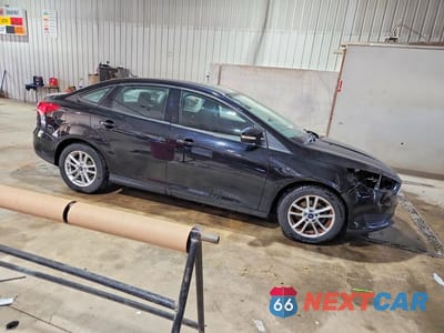 Czwarte zdjęcie samochodu z boku: 2016 FORD FOCUS SE VIN:1FADP3F20GL256595 - miniatura