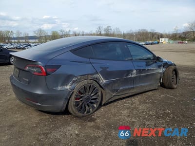 Trzecie zdjęcie samochodu z tyłu: 2022 TESLA MODEL 3 VIN:5YJ3E1EC6NF269524 - miniatura