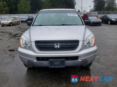 Piąte zdjęcie samochodu w środku: 2005 HONDA PILOT LX VIN:2HKYF18105H545565 - miniatura