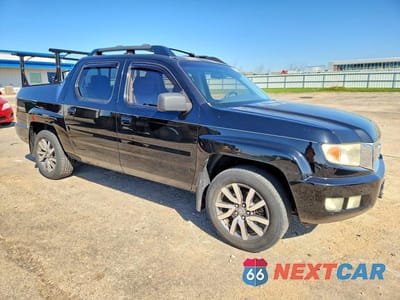 Czwarte zdjęcie samochodu z boku: 2010 HONDA RIDGELINE RTL VIN:5FPYK1F53AB001143 - miniatura