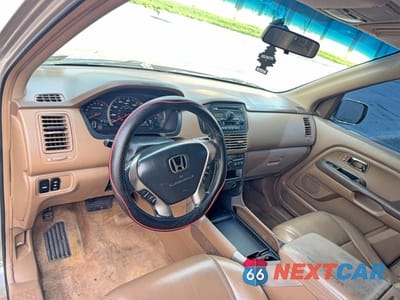 Zdjęcie 9 z 10 samochodu: 2003 HONDA PILOT EXL VIN:2HKYF18553H600995 - miniatura