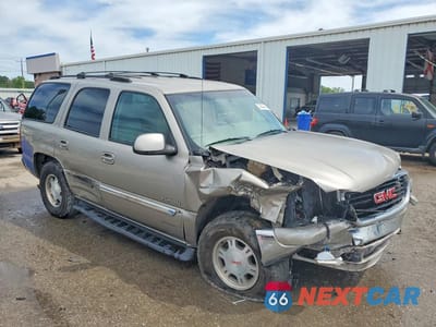 Czwarte zdjęcie samochodu z boku: 2002 GMC YUKON VIN:1GKEC13V42R251696 - miniatura