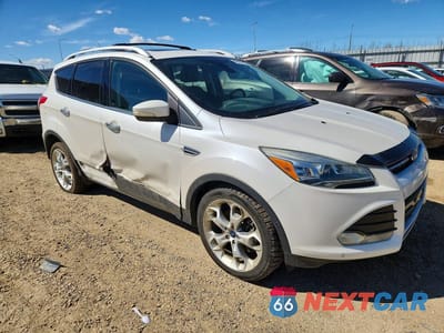 Czwarte zdjęcie samochodu z boku: 2014 FORD ESCAPE TITANIUM VIN:1FMCU9J92EUD90033 - miniatura