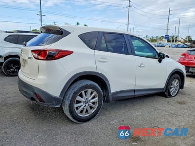 Trzecie zdjęcie samochodu z tyłu: 2016 MAZDA CX-5 TOURING VIN:JM3KE2CY4G0635635 - miniatura