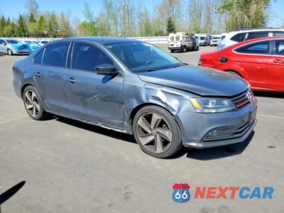 Czwarte zdjęcie samochodu z boku: 2016 VOLKSWAGEN JETTA S VIN:3VW267AJ6GM392753 - miniatura