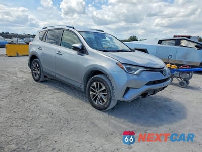 Czwarte zdjęcie samochodu z boku: 2018 TOYOTA RAV4 HYBRID LE VIN:JTMRJREV5JD213856 - miniatura
