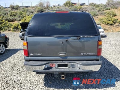 Zdjęcie 6 z 13 samochodu: 2001 CHEVROLET TAHOE K1500 VIN:1GNEK13T31R191090 - miniatura