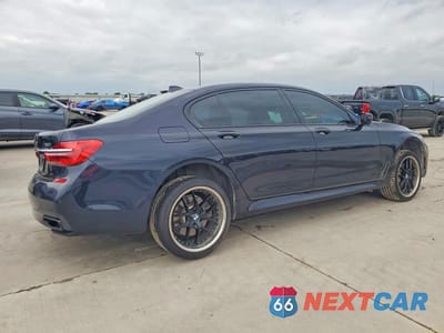 Trzecie zdjęcie samochodu z tyłu: 2018 BMW 750 I VIN:WBA7F0C5XJGM24179 - miniatura