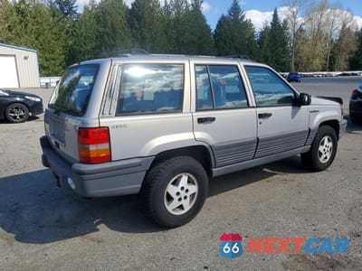 Trzecie zdjęcie samochodu z tyłu: 1995 JEEP GRAND CHEROKEE LAREDO VIN:1J4GZ58S8SC563817 - miniatura