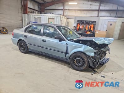 Czwarte zdjęcie samochodu z boku: 1999 HONDA CIVIC LX VIN:2HGEJ6677XH582180 - miniatura