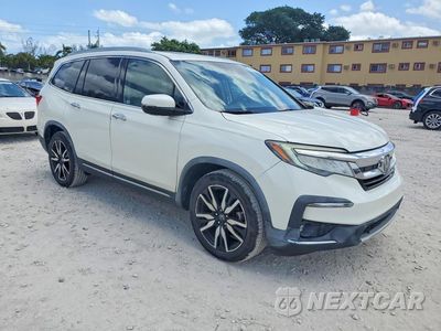Czwarte zdjęcie samochodu z boku: 2019 HONDA PILOT TOURING VIN:5FNYF5H90KB012980 - miniatura