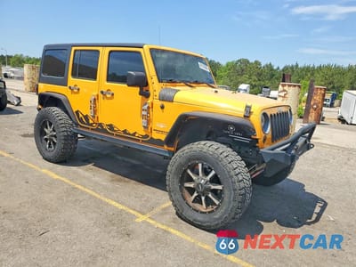 Czwarte zdjęcie samochodu z boku: 2013 JEEP WRANGLER UNLIMITED SAHARA VIN:1C4BJWEG9DL557847 - miniatura