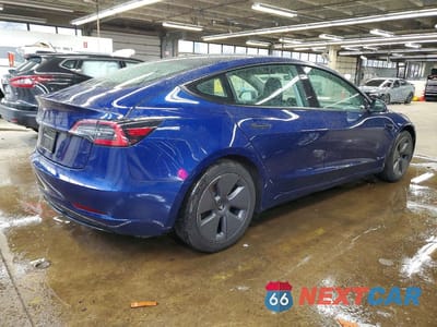 Trzecie zdjęcie samochodu z tyłu: 2022 TESLA MODEL 3 VIN:5YJ3E1EA8NF370370 - miniatura