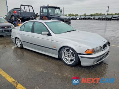 Czwarte zdjęcie samochodu z boku: 1999 BMW 540 I VIN:WBADN5335XGC91604 - miniatura