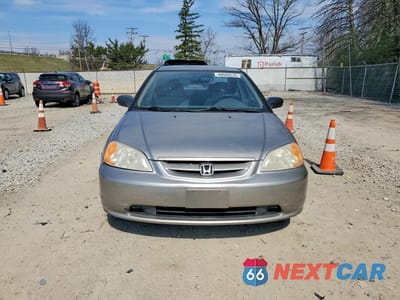 Piąte zdjęcie samochodu w środku: 2003 HONDA CIVIC LX VIN:1HGEM22553L041971 - miniatura