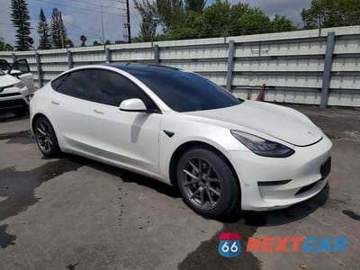 Czwarte zdjęcie samochodu z boku: 2021 TESLA MODEL 3 VIN:5YJ3E1EA2MF853819 - miniatura