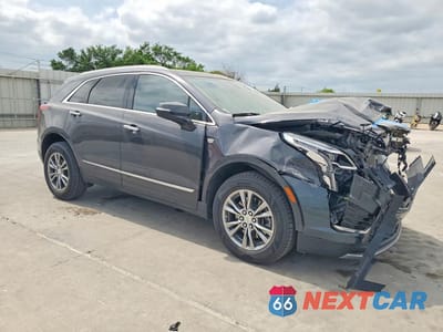 Czwarte zdjęcie samochodu z boku: 2022 CADILLAC XT5 PREMIUM LUXURY VIN:1GYKNCRS4NZ172366 - miniatura
