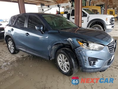 Czwarte zdjęcie samochodu z boku: 2016 MAZDA CX-5 TOURING VIN:JM3KE4CYXG0634064 - miniatura