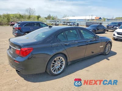 Trzecie zdjęcie samochodu z tyłu: 2014 BMW 750 VIN:WBAYB6C55ED224398 - miniatura