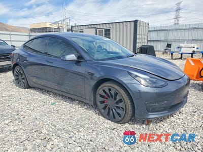Czwarte zdjęcie samochodu z boku: 2023 TESLA MODEL 3 VIN:5YJ3E1EC7PF619200 - miniatura