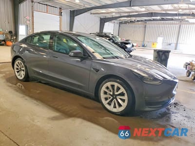 Czwarte zdjęcie samochodu z boku: 2023 TESLA MODEL 3 VIN:5YJ3E1EA6PF449166 - miniatura