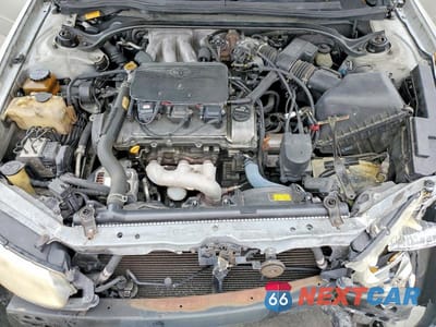 Zdjęcie 11 z 12 samochodu: 1999 TOYOTA CAMRY SOLARA SLE V6 VIN:2T1CF22PXXC120163 - miniatura