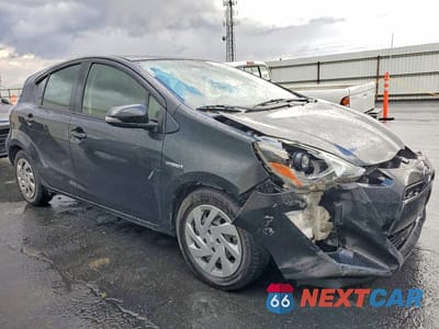 Czwarte zdjęcie samochodu z boku: 2015 TOYOTA PRIUS C TWO VIN:JTDKDTB31F1586524 - miniatura