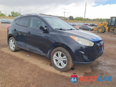 Czwarte zdjęcie samochodu z boku: 2011 HYUNDAI TUCSON GLS VIN:KM8JUCAC9BU156922 - miniatura