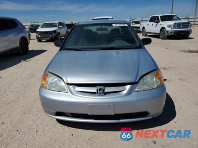 Piąte zdjęcie samochodu w środku: 2002 HONDA CIVIC LX VIN:1HGEM21562L002919 - miniatura