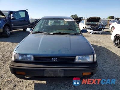 Piąte zdjęcie samochodu w środku: 1992 TOYOTA COROLLA DELUXE VIN:JT2AE94K3N3499106 - miniatura