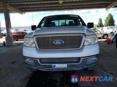 Piąte zdjęcie samochodu w środku: 2004 FORD F150 VIN:1FTPX12564NA59006 - miniatura