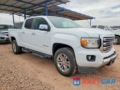 Czwarte zdjęcie samochodu z boku: 2016 GMC CANYON SLT VIN:1GTG5DE31G1127791 - miniatura