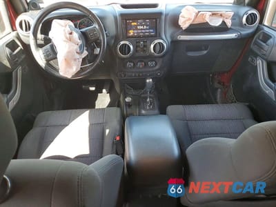 Zdjęcie 8 z 11 samochodu: 2012 JEEP WRANGLER UNLIMITED SAHARA VIN:1C4BJWEG6CL157078 - miniatura