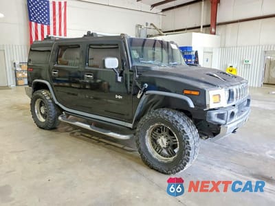 Czwarte zdjęcie samochodu z boku: 2004 HUMMER H2 VIN:5GRGN23U54H121073 - miniatura