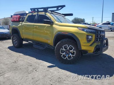 Czwarte zdjęcie samochodu z boku: 2023 GMC CANYON AT4X VIN:1GTP6EEK9P1265475 - miniatura