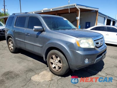Czwarte zdjęcie samochodu z boku: 2010 HONDA PILOT TOURING VIN:5FNYF4H83AB021401 - miniatura
