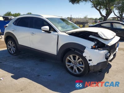 Czwarte zdjęcie samochodu z boku: 2022 MAZDA CX-30 SELECT VIN:3MVDMBBL1NM435315 - miniatura