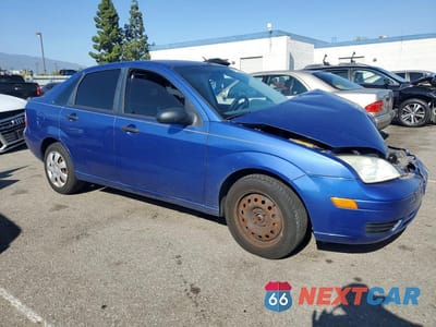 Czwarte zdjęcie samochodu z boku: 2005 FORD FOCUS ZX4 VIN:1FAFP34NX5W293588 - miniatura