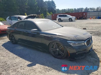 Czwarte zdjęcie samochodu z boku: 2018 BMW 750 XI VIN:WBA7B0C55JG527229 - miniatura