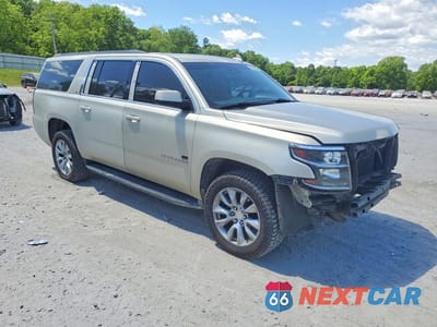 Czwarte zdjęcie samochodu z boku: 2015 CHEVROLET SUBURBAN K1500 LT VIN:1GNSKJKC5FR611024 - miniatura