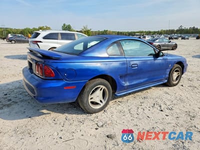 Trzecie zdjęcie samochodu z tyłu: 1997 FORD MUSTANG VIN:1FALP404XVF207704 - miniatura