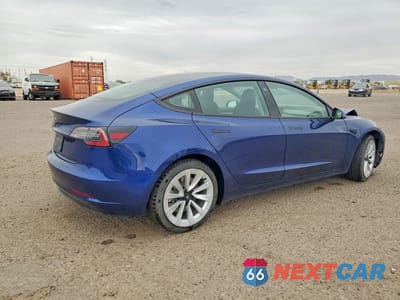 Trzecie zdjęcie samochodu z tyłu: 2023 TESLA MODEL 3 VIN:5YJ3E1EA4PF447318 - miniatura