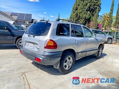 Czwarte zdjęcie samochodu z boku: 2001 HYUNDAI SANTA FE GL VIN:KM8SC83D01U126863 - miniatura