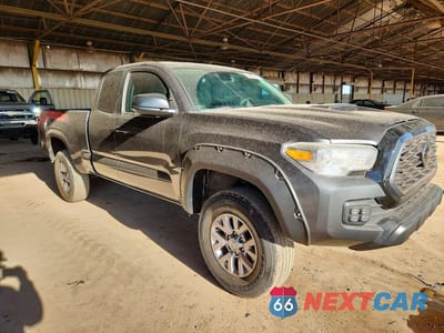 Czwarte zdjęcie samochodu z boku: 2023 TOYOTA TACOMA SR VIN:3TYRX5GNXPT086222 - miniatura